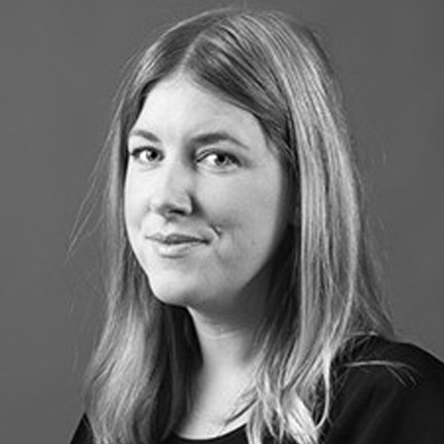 Portrait of a woman with long hair in black and white.